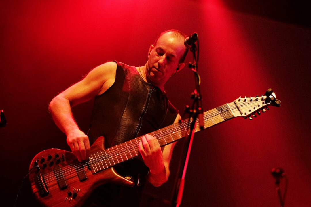Trey Gunn playing a Warr Guitar in concert